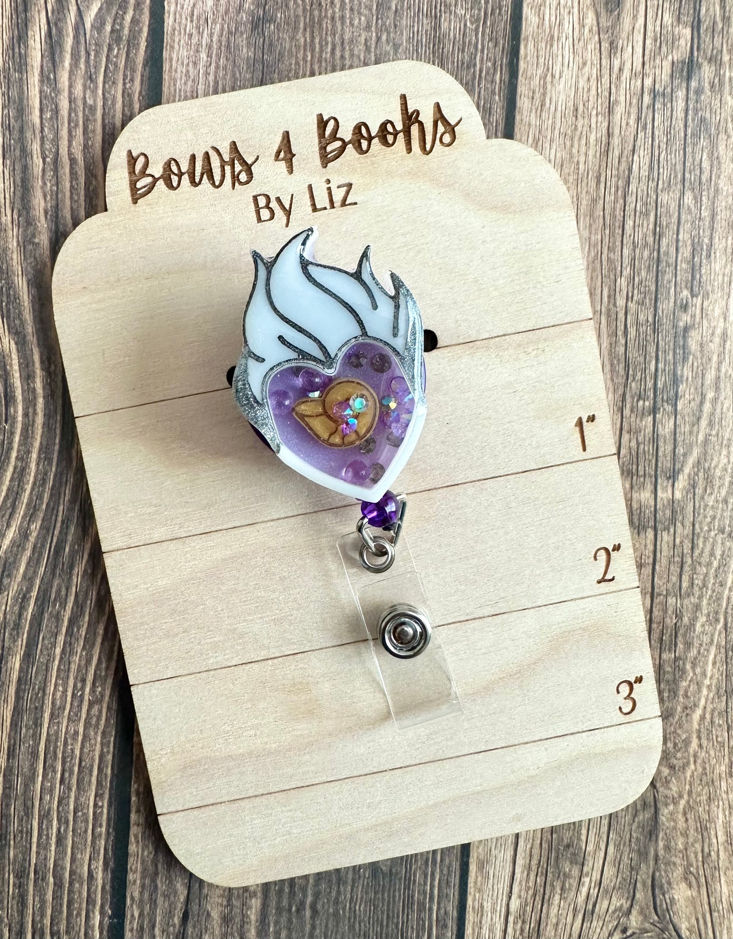 Scary sea lady badge reel